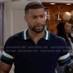 Martin’s navy polo shirt with striped trims on Beyond the Gates