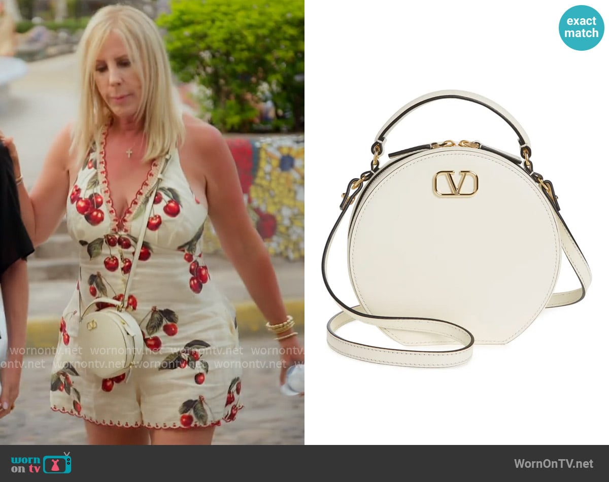 Valentino Garavani VLOGO Signature Circle Crossbody Bag worn by Vicki Gunvalson on The Real Housewives of Orange County