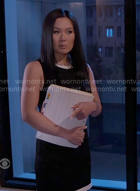 Caroline's black dress with white trims on Beyond the Gates