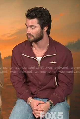 Chase Stokes’s burgundy half-zip sweatshirt on Extra Chase Stokes’s burgundy half-zip sweatshirt on Extra