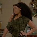 Eva’s brown leggings and bra with green tie-dye top on Beyond the Gates