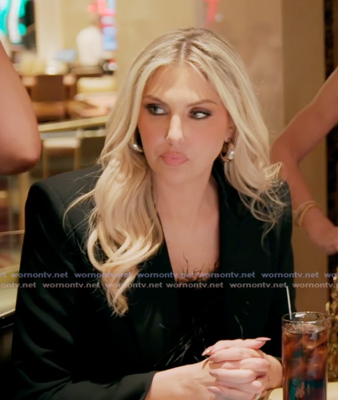 Gina’s black feather crop top on The Real Housewives of Orange County Gina’s black feather crop top on The Real Housewives of Orange County