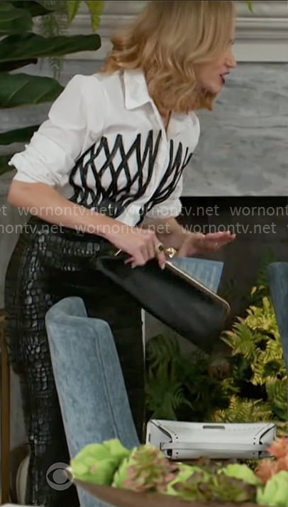 Heather’s white shirt with black lattice front and croc skirt on Beyond the Gates Heather’s white shirt with black lattice front and croc skirt on Beyond the Gates