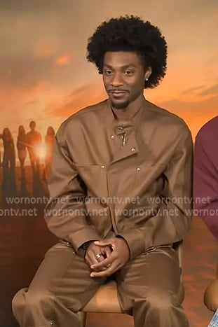 Jonathan Daviss’s brown moto jacket and pants on Extra Jonathan Daviss’s brown moto jacket and pants on Extra
