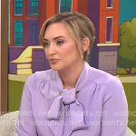 Kelly O’Grady’s lavender purple tie-neck blouse on CBS Mornings Kelly O’Grady’s lavender purple tie-neck blouse on CBS Mornings