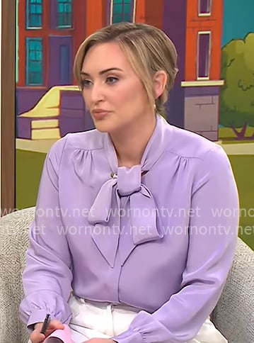 Kelly O’Grady’s lavender purple tie-neck blouse on CBS Mornings Kelly O’Grady’s lavender purple tie-neck blouse on CBS Mornings