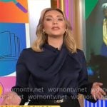 Kelly O’Grady’s navy satin blouse on CBS Mornings Kelly O’Grady’s navy satin blouse on CBS Mornings