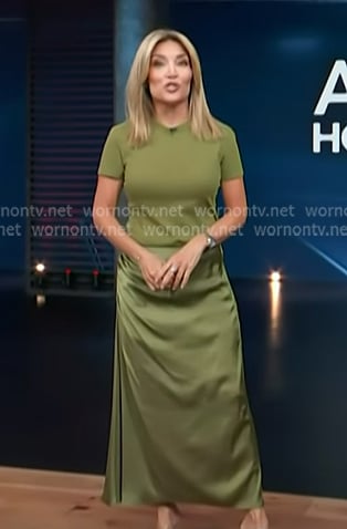Kit's green tee and satin skirt on Access Hollywood