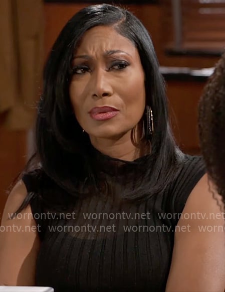 Leslie’s sheer black rib top on Beyond the Gates