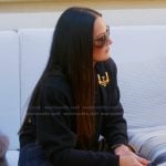 Lisa’s black buckle detail sweater on The Real Housewives Ultimate Girls Trip Lisa’s black buckle detail sweater on The Real Housewives Ultimate Girls Trip