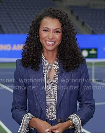 Malika Andrews’s paisley print shirt and pinstripe denim blazer on Good Morning America Malika Andrews’s paisley print shirt and pinstripe denim blazer on Good Morning America