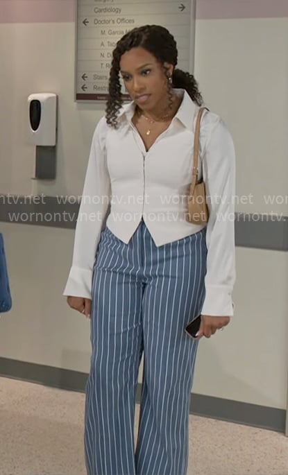 Naomi’s white vest and blue striped pants on Beyond the Gates Naomi’s white vest and blue striped pants on Beyond the Gates
