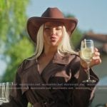Olivia's brown trench jacket on The Girls A Khloe Kardashian Project