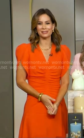 Rebecca Jarvis's orange ruched front dress on Good Morning America