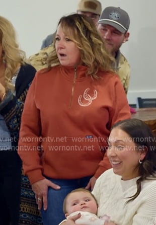 Tessa's orange half-zip sweatshirt on The McBee Dynasty Real American Cowboys