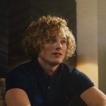 Thom's navy logo polo on The Shards