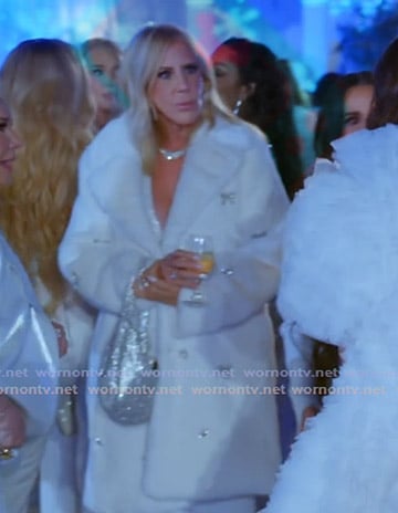 Vicki's white bow embellished coat on The Real Housewives Ultimate Girls Trip