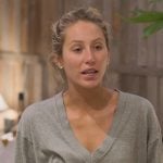 Alix’s gray v-neck sweatshirt on Earle Meets World