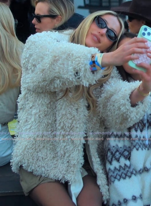 Alix's white shaggy jacket on Earle Meets World