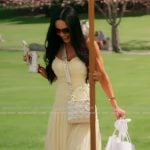 Carmella’s yellow smocked maxi dress on The Real Housewives of Orange County