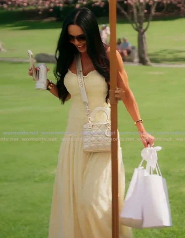 Carmella’s yellow smocked maxi dress on The Real Housewives of Orange County