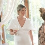 Erin’s white v-neck sheath dress on The Real Housewives of New York City