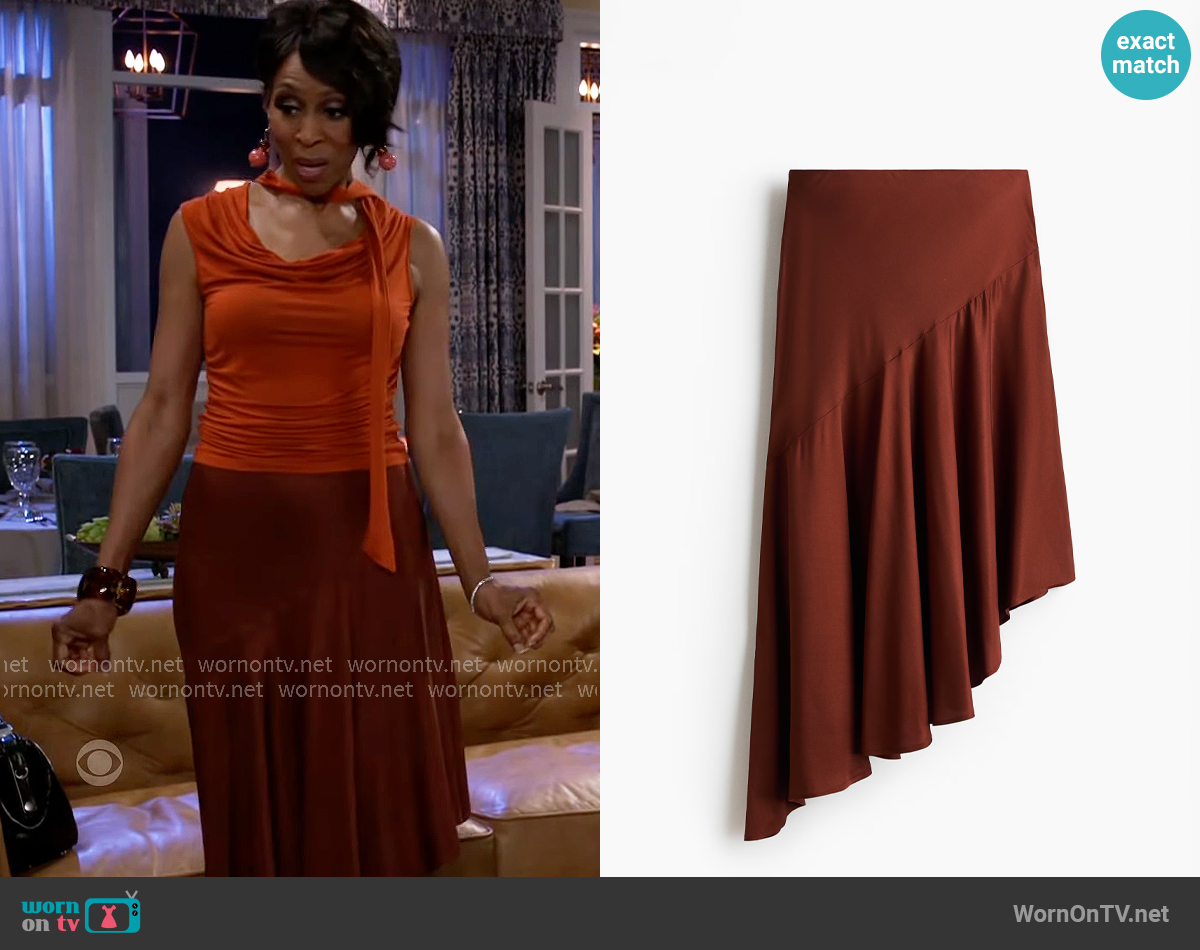 H&M Asymmetric Viscose Skirt in Rust Brown worn by Sharon Winger (Bonita Brisker) on Beyond the Gates H&M Asymmetric Viscose Skirt in Rust Brown worn by Sharon Winger (Bonita Brisker) on Beyond the Gates