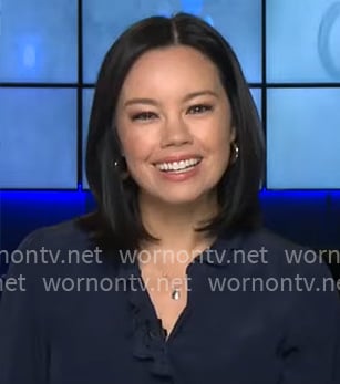 Jo Ling Kent's navy scalloped trim top on CBS Mornings