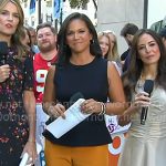 Laura’s black peplum top and orange pants on Today