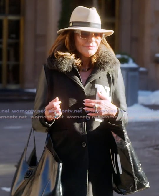 Luann’s black mixed media coat on The Real Housewives Ultimate Girls Trip Luann’s black mixed media coat on The Real Housewives Ultimate Girls Trip