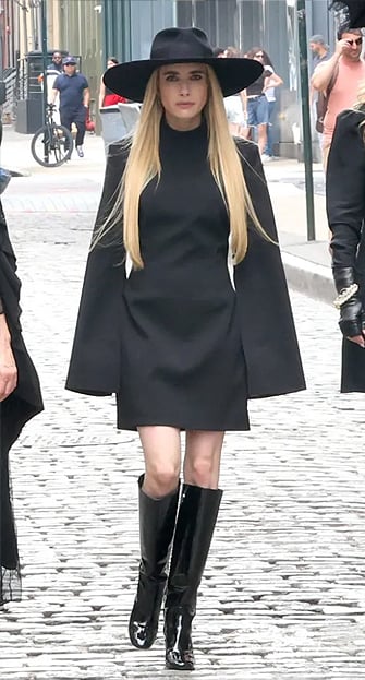 Madison’s black cape-sleeve mini dress on American Horror Story
