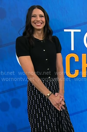 Natalie’s black short sleeve cardigan and printed skirt on Today