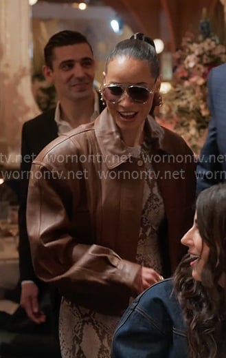 Sai’s brown leather jacket and snake dress on The Real Housewives of New York City Sai’s brown leather jacket and snake dress on The Real Housewives of New York City