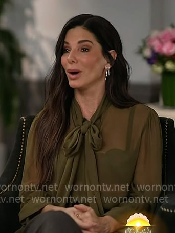 Sandra Bullock’s green tie neck blouse on Today