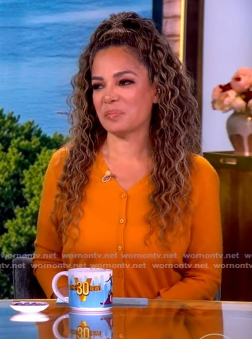 Sunny’s orange knit cardigan on The View Sunny’s orange knit cardigan on The View