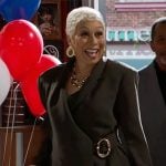 Anita's dark green suit with gold detail on Beyond the Gates