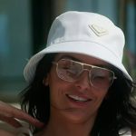 Erika's white buckle tank and bucket hat on The Real Housewives of New York City Erika's white buckle tank and bucket hat on The Real Housewives of New York City