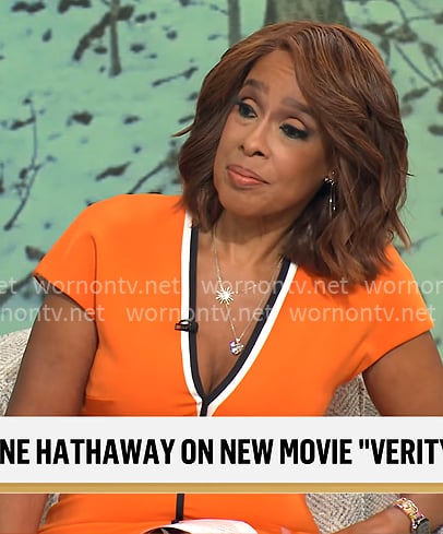 Gayle King's orange v-neck dress with black trim on CBS This Morning