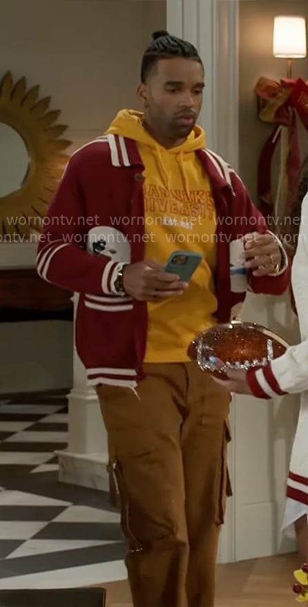 Izaiah’s red varsity cardigan with patches and cargo pants on Beyond the Gates Izaiah’s red varsity cardigan with patches and cargo pants on Beyond the Gates