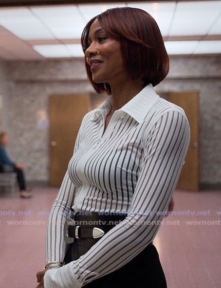 Jax's white sheer stripe blouse and skirt on Reasonable Doubt
