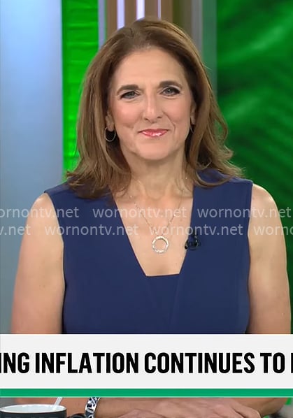 Jill Schlesinger’s navy v-neck dress on CBS Mornings