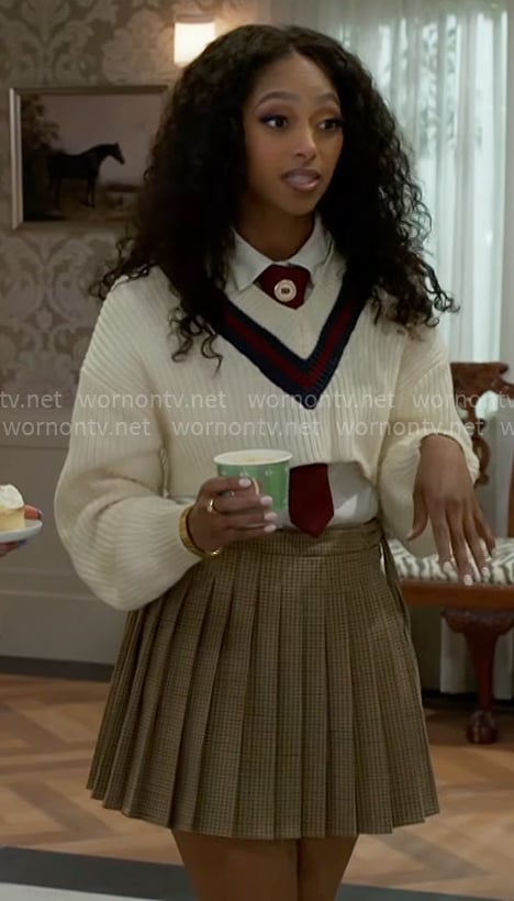 Kat’s cropped varsity sweater and pleated skirt on Beyond the Gates Kat’s cropped varsity sweater and pleated skirt on Beyond the Gates
