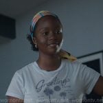 Naima’s white Greetings from Palm Springs print tee on Reasonable Doubt