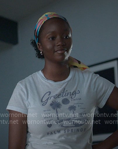 Naima's white Greetings from Palm Springs print tee on Reasonable Doubt
