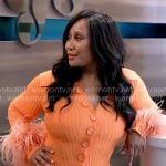 Pam's orange button-front dress with feathers on Tyler Perrys Sistas