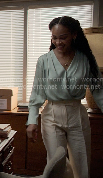 Regina’s light green wrap blouse on Reasonable Doubt