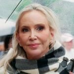 Shannon’s white check print poncho jacket on The Real Housewives of Orange County Shannon’s white check print poncho jacket on The Real Housewives of Orange County