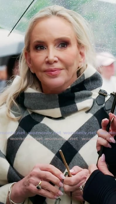 Shannon’s white check print poncho jacket on The Real Housewives of Orange County Shannon’s white check print poncho jacket on The Real Housewives of Orange County