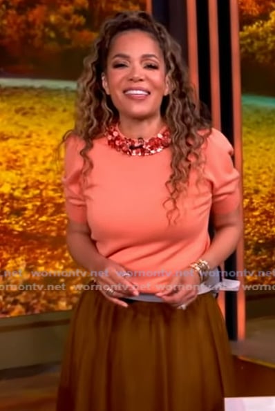 Sunny’s orange embellished neckline sweater on The View