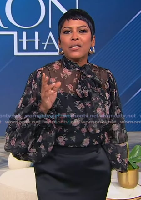 Tamron’s black floral tie neck blouse on Tamron Hall Show Tamron’s black floral tie neck blouse on Tamron Hall Show